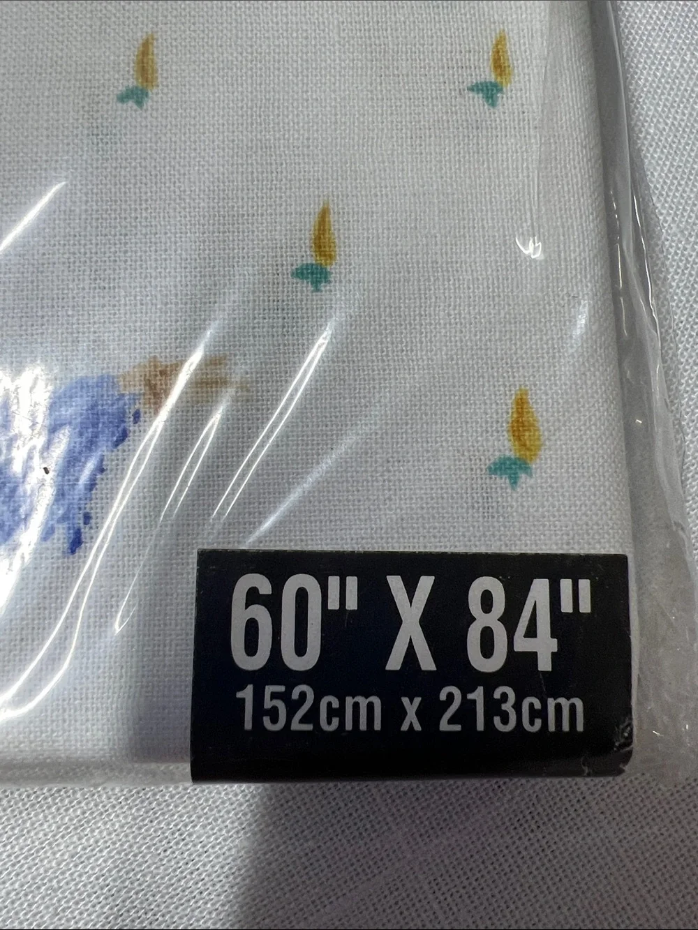 Tobin Holiday Tablecloth — White with Yellow, Blue, Pink & Green bunny Accents